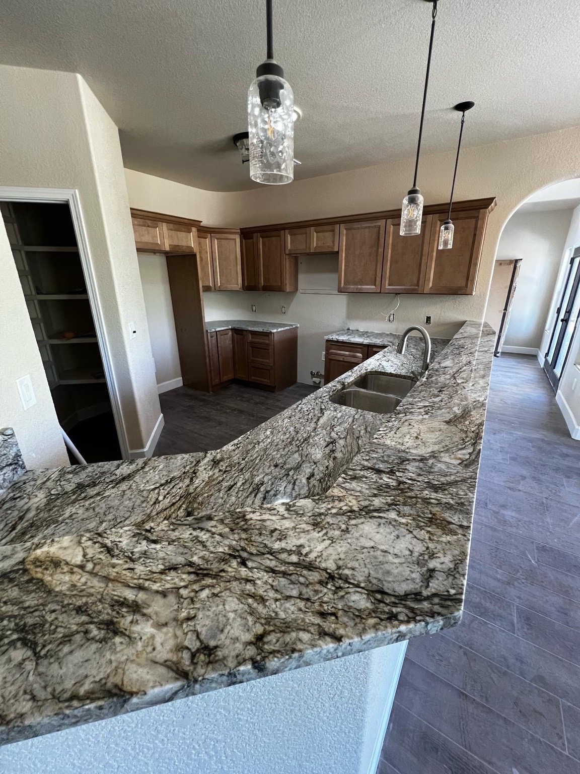 Large island with countertop and custom cabinetry